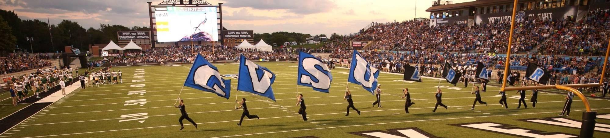 GVSU marching band running out on football field